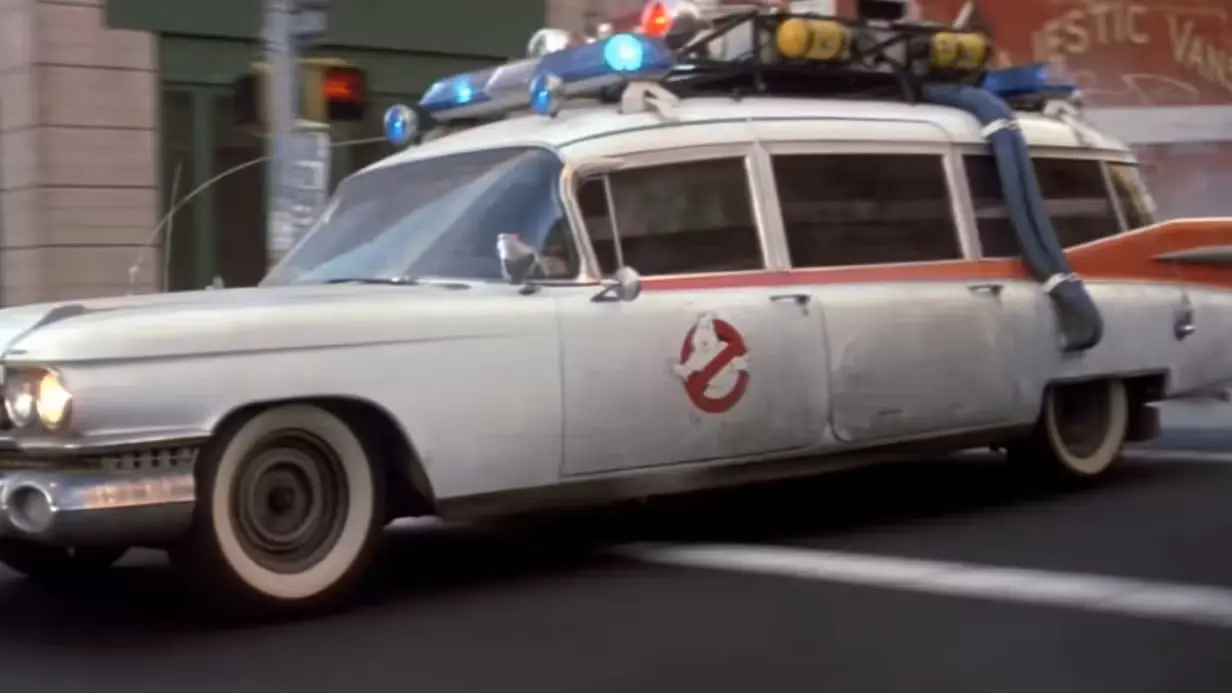 The Ecto-1, the Ghostbusters' car, driving down a New York street